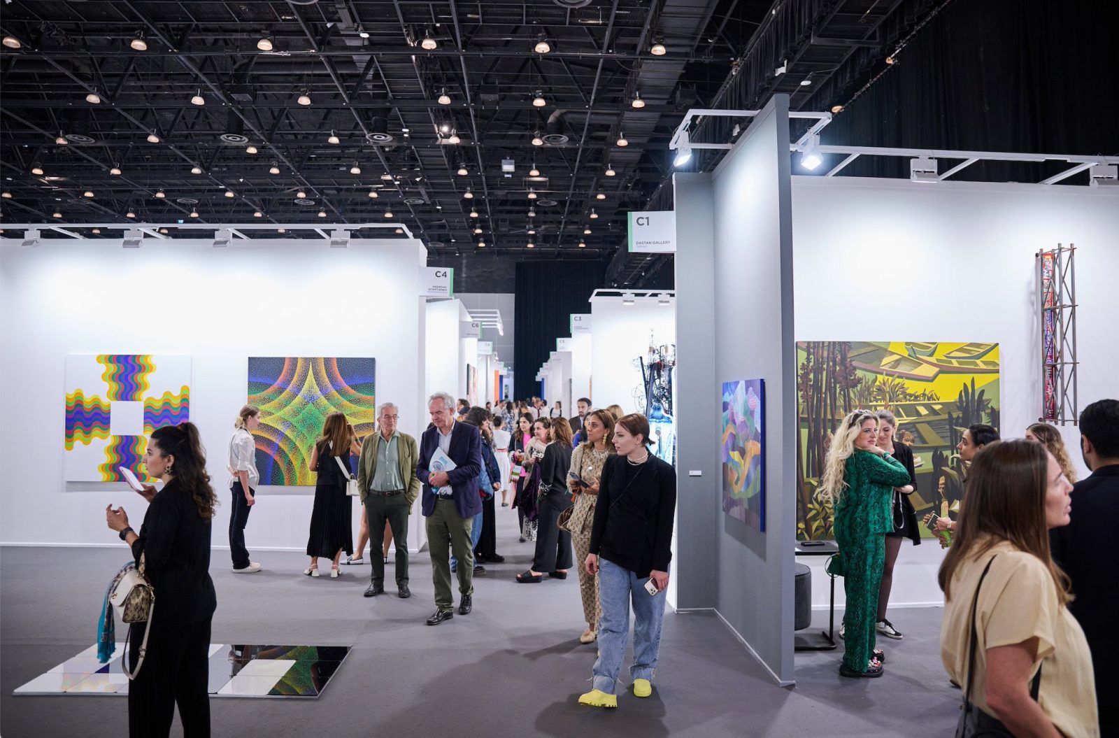 Visitors walking through a contemporary art exhibition