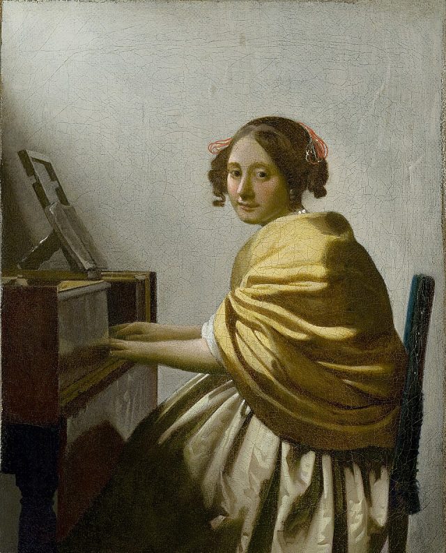 Young_Woman_Seated_at_a_Virgin Young_Woman_Seated_at_a_Virgin