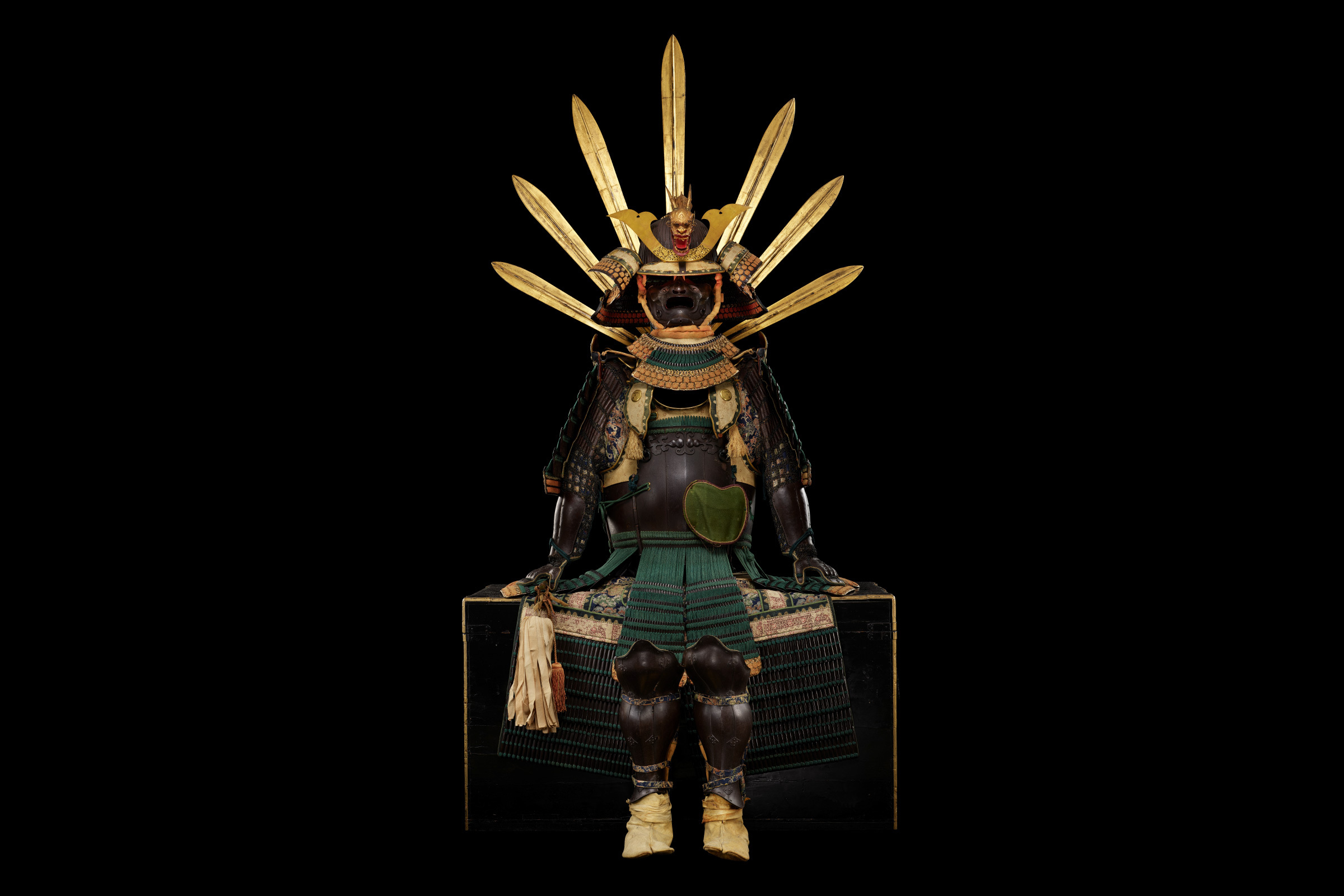 Suit of armour and helmet Iron, silk, wool, leather, gold and lacquer, Japan, 1519 (helmet), 1696 (armour) and 1800s (textiles) Purchase made possible by the JTI Japanese Acquisition Fund. © The Trustees of the British Museum