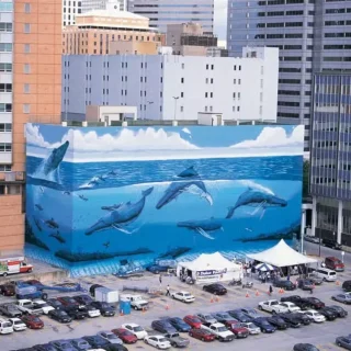 Robert Wyland's Dallas mural depicted endangered whales and dolphins swimming in the ocean. Wyland Foundation